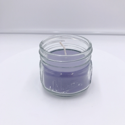 Jasnofioletowa świeca zapachowa Aromatherapy Associates do masażu