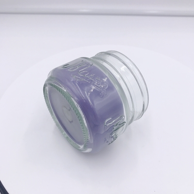 Jasnofioletowa świeca zapachowa Aromatherapy Associates do masażu