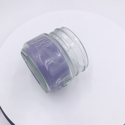 Jasnofioletowa świeca zapachowa Aromatherapy Associates do masażu